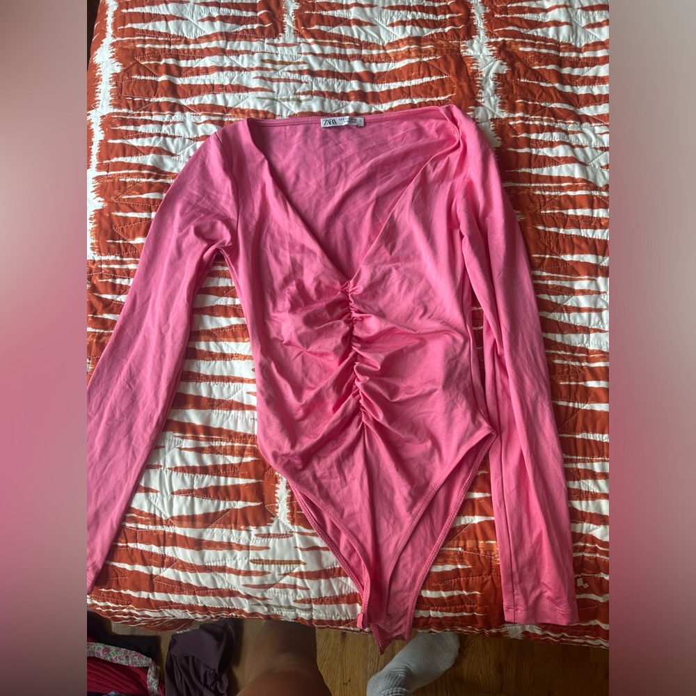 Pink long sleeve body suit